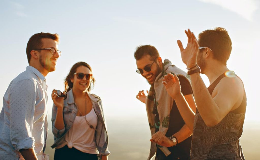 A group of teenagers engaged in a conversation, possibly discussing the dangers and effects of dabbing weed.