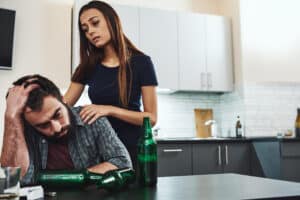 concerned woman with a distraught man in kitchen 2026 01 09 07 19 56 utc