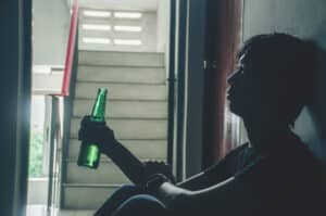 silhouette of thoughtful adult with green bottle 2026 01 11 10 36 20 utc