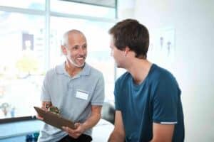 mature man consulting with patient in clinic 2026 03 25 06 34 44 utc 1