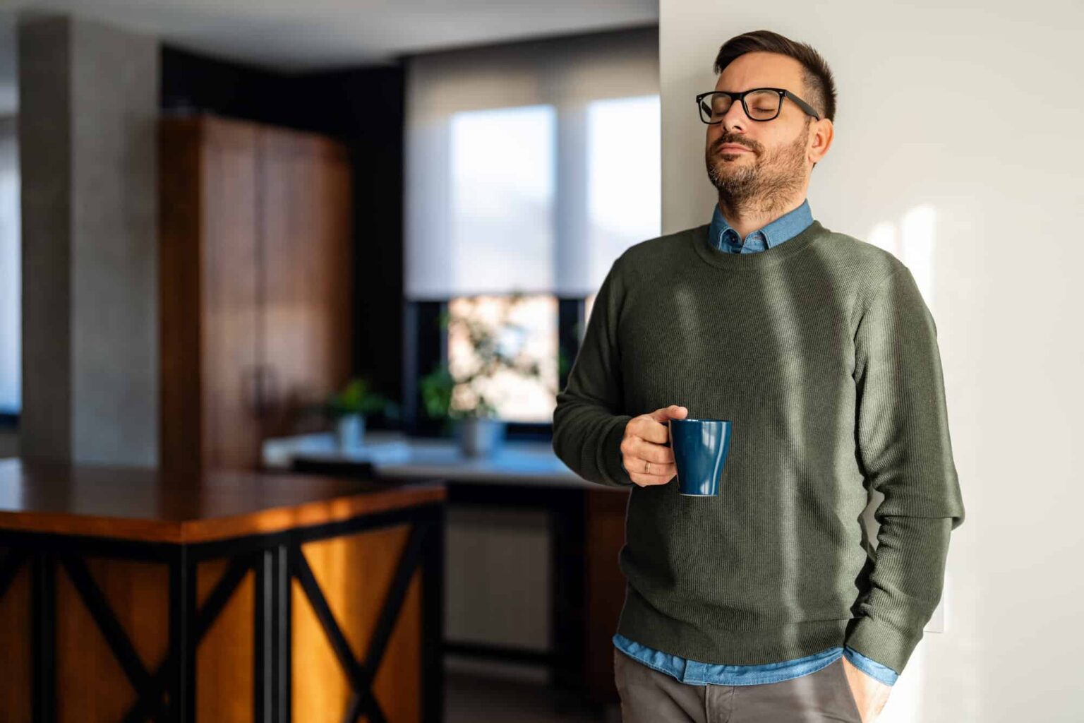 man at home enjoying a coffee after rehab
