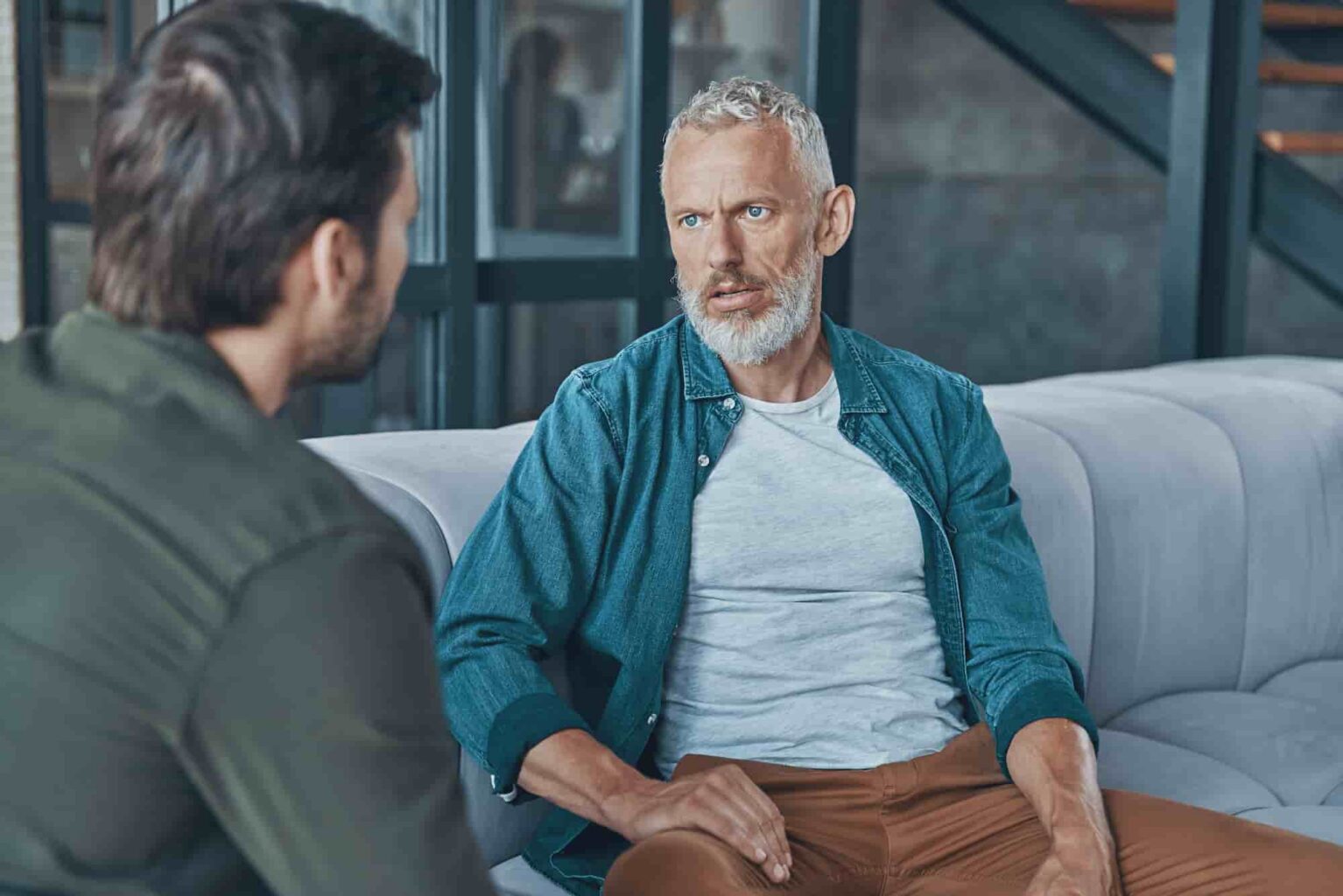 man having a serious discussion with friend indoor 2026 09 23 18 26 10 utc 1