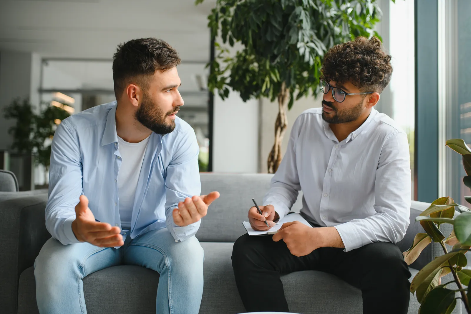 Man meeting oneonone with a counselor, the kind of individual therapy BCBS plans may cover
