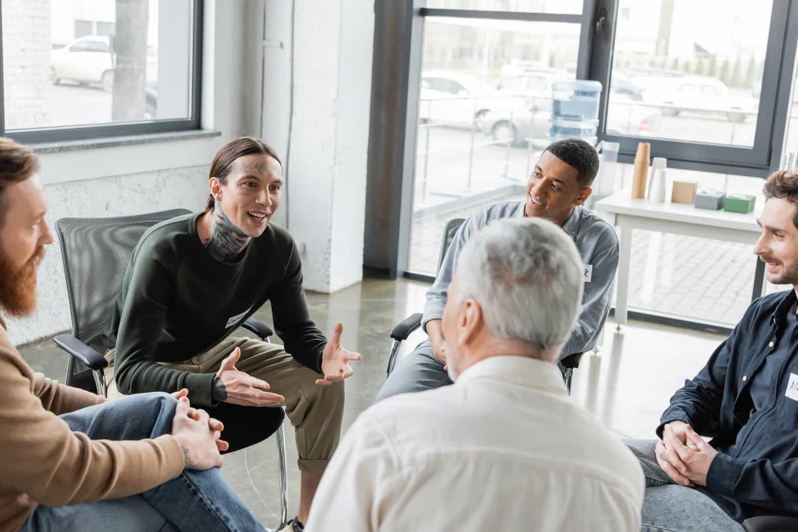 Men in a group therapy session at Heartwood Recovery